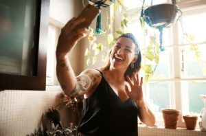 young woman taking selfie for social media potentially leading to depression