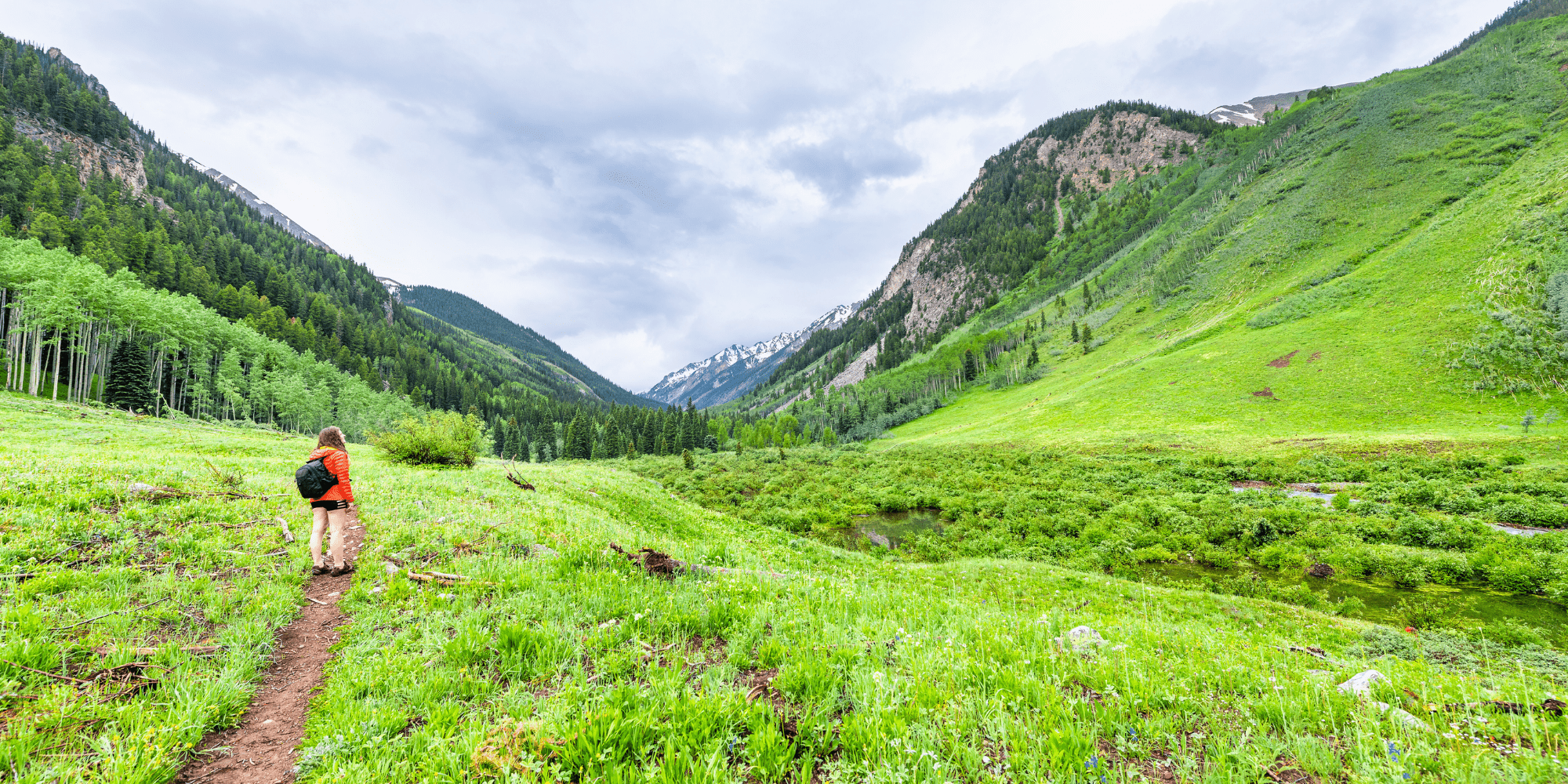 woman in green field starting mental health journey with Lemonaid Health