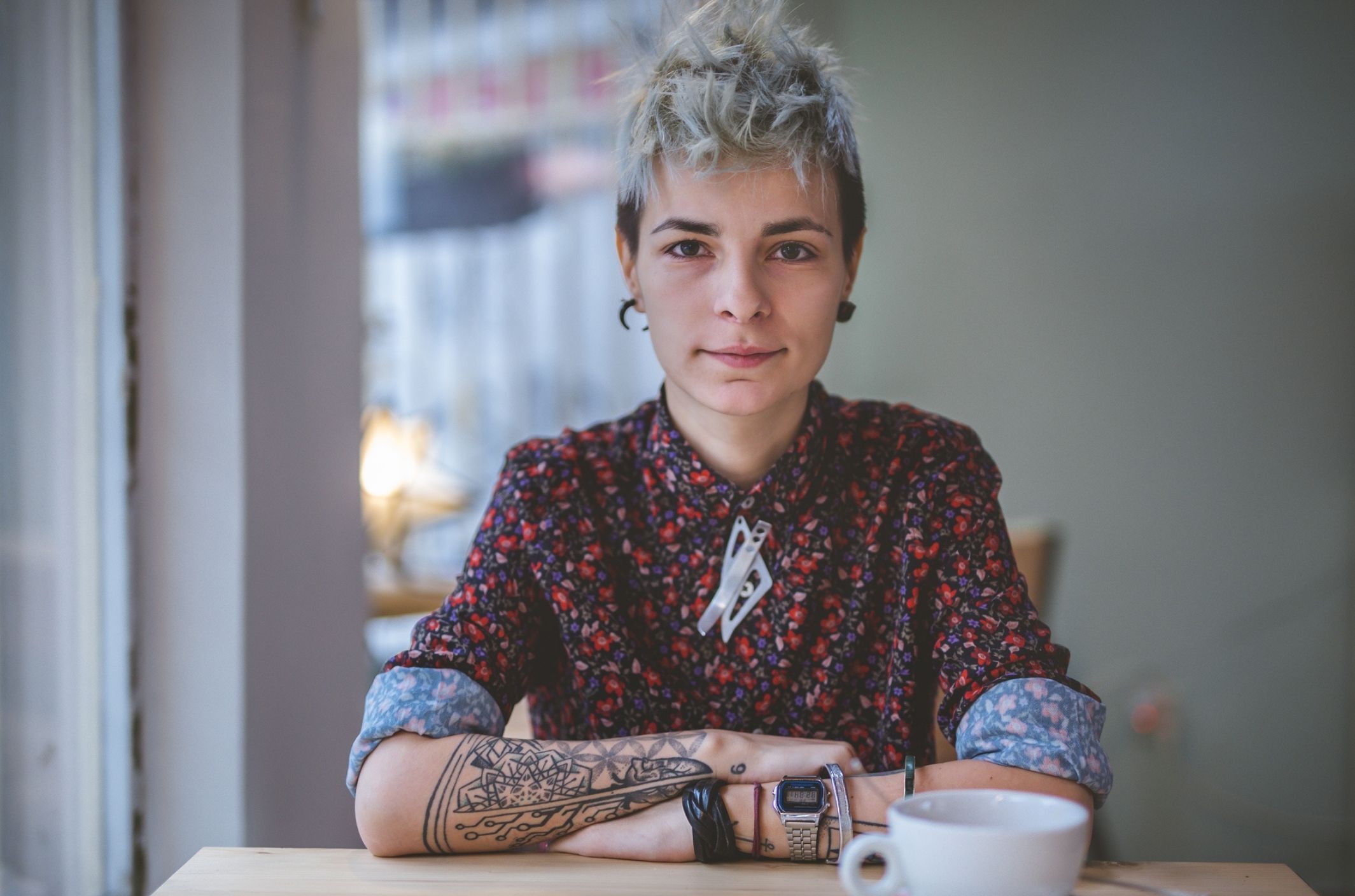 young woman tattoos practicing with negative self talk and inner critic